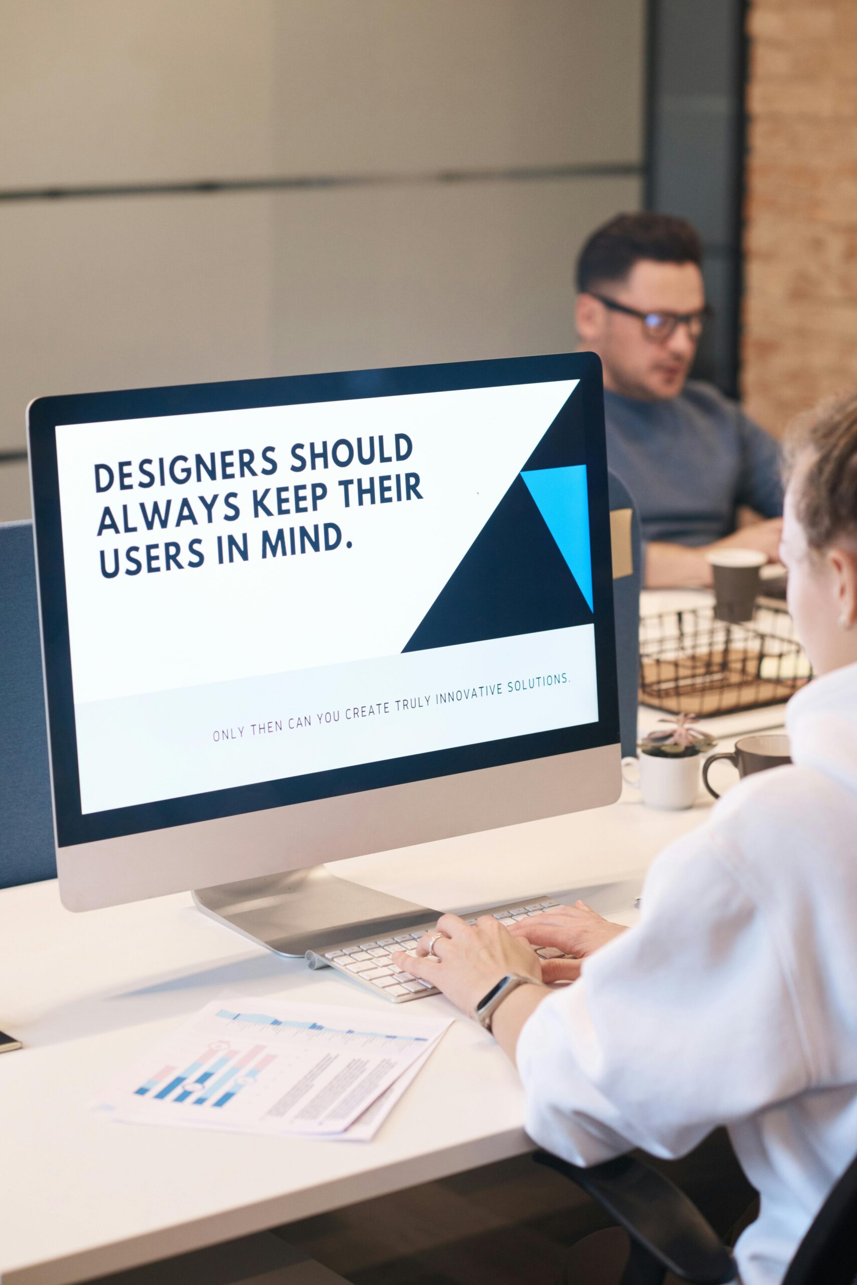 pexels-photo-3184612-3184612 A focused designer works on a user-centric project in a modern office environment.